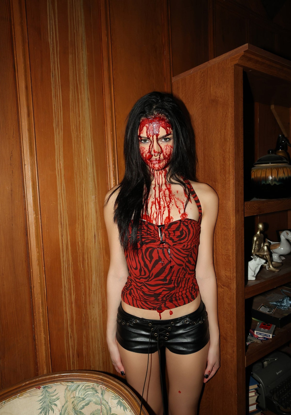Red zebra print halter top with black faux leather shorts