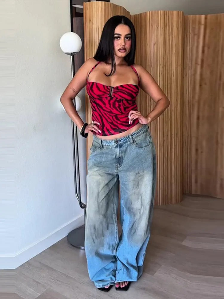 Red and black zebra print mesh halter top worn with jeans